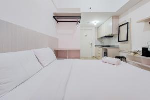 Ένα ή περισσότερα κρεβάτια σε δωμάτιο στο Comfy Studio at Poris 88 Apartment By Travelio +10 φωτογραφίες