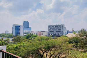 a view of a city with tall buildings at Nice and Elegant Studio at Tree Park City BSD Apartment By Travelio in Tangerang