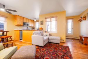 a living room with a couch and a table at Casita Gomez- Courtyard - Quiet - Railyard - 1BR in Santa Fe