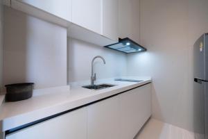 Η κουζίνα ή μικρή κουζίνα στο Pattaya Interstellar Village Resort House +3 φωτογραφίες