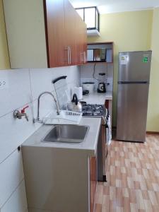 Η κουζίνα ή μικρή κουζίνα στο Habich Apartment