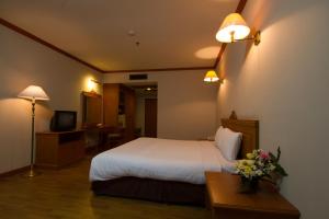 Katil atau katil-katil dalam bilik di Rimpao Hotel