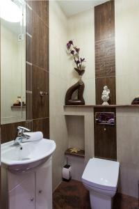 a bathroom with a white sink and a toilet at VIP Apartamenty Jagiellonska 33a in Zakopane +38 photos