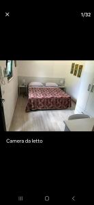 A bed or beds in a room at Casa Polinisso