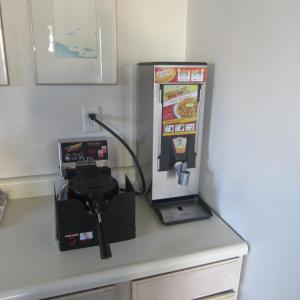 a video game machine sitting on top of a counter at Pacific Best Inn in Seaside