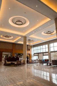 a lobby of a hotel with couches and tables at Sheraton Kosgoda Turtle Beach Resort in Bentota