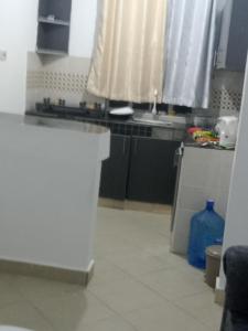 a kitchen with a sink and a counter top at Garden court in Lukenya