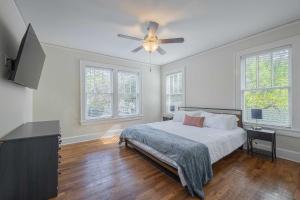 a bedroom with a bed and a ceiling fan at The Complex on Bobbins Mill in Athens