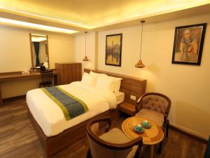 Letto o letti in una camera di Harsha Boutique Hotel