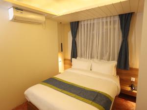 Letto o letti in una camera di Harsha Boutique Hotel
