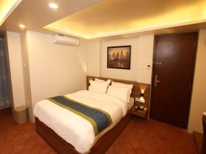 Letto o letti in una camera di Harsha Boutique Hotel