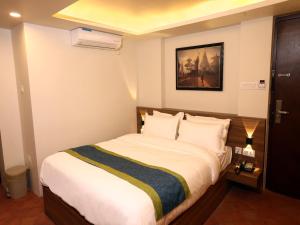 Letto o letti in una camera di Harsha Boutique Hotel