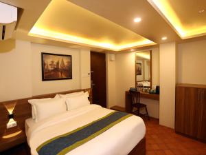 Letto o letti in una camera di Harsha Boutique Hotel