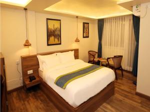 Letto o letti in una camera di Harsha Boutique Hotel