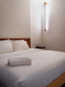 T+ PREMIUM HOTEL客房内的一张或多张床位