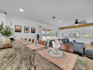 a living room with a couch and a table at Boulder Apache Junction in Apache Junction