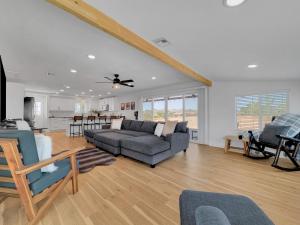 a living room with a couch and a table at Boulder Apache Junction in Apache Junction
