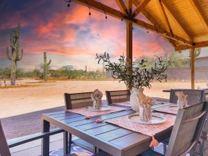 a wooden table with a vase on top of it at Boulder Apache Junction in Apache Junction