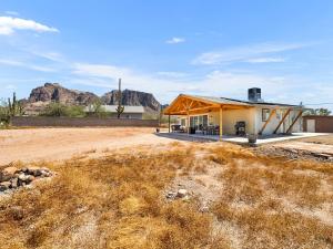a house in the desert with a mountain in the background at Boulder Apache Junction in Apache Junction