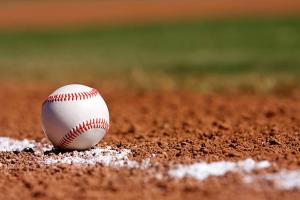 a white baseball sitting on a baseball field at Boulder Apache Junction in Apache Junction