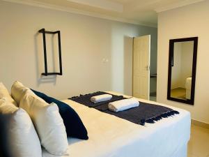 Voodi või voodid majutusasutuse Executive Suites and Spa toas