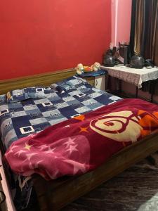 Postel nebo postele na pokoji v ubytování Homestay by Anand