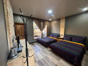Postel nebo postele na pokoji v ubytování Sky View Bromo Guest House