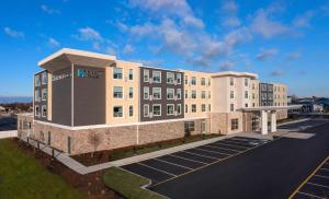 a building with a parking lot in front of it at Hyatt House Lewes Rehoboth Beach in Lewes