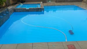 a swimming pool with blue lights in the water at The bridge Guest House in Newcastle