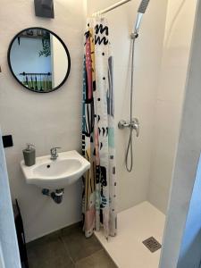 a bathroom with a sink and a shower curtain at Sunshine loft in Gran Alacant +31 photos