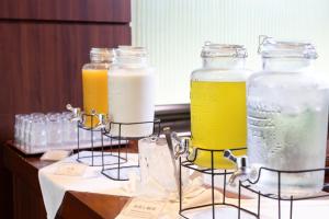 a group of three jars of drinks on a table at Sun Days Kagoshima in Kagoshima