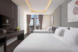 Postelja oz. postelje v sobi nastanitve Mercy Emerald Hotel