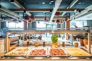 a buffet line with many different types of food at Elements Hotel&Spa in Świeradów-Zdrój
