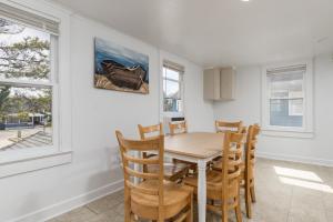 a dining room with a table and chairs at Somerset 4 in Ocean City +3 photos