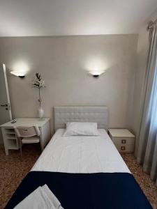 Postel nebo postele na pokoji v ubytování Locazione Turistica Joyful Padova