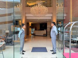 Členové personálu v ubytování Civic Horizon Hotel & Residence + 37 fotografií