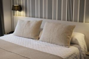 Postel nebo postele na pokoji v ubytování New Hotel Colon
