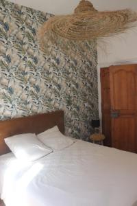 Ένα ή περισσότερα κρεβάτια σε δωμάτιο στο Appartement ultra centre Sète climatisé