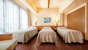 A bed or beds in a room at Bull Astoria