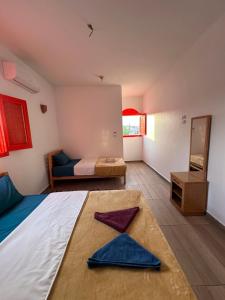 Postel nebo postele na pokoji v ubytování Palm Geust House