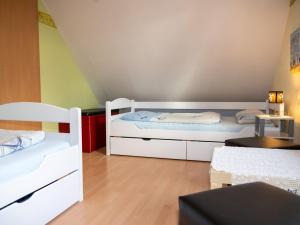 Postel nebo postele na pokoji v ubytování As bi uns to Huus