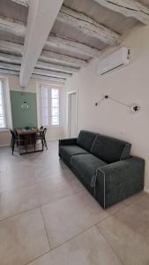 a living room with a couch and a table at VerdeLago in Como