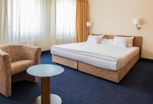 Postel nebo postele na pokoji v ubytování Hotel Residenz Limburgerhof