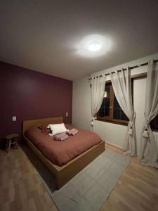 Rúm í herbergi á Chambre Au Grès des Vosges - À l'Ancien Hôtel de Reichsfeld