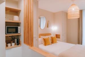 Postel nebo postele na pokoji v ubytování Sézam appart-hôtel