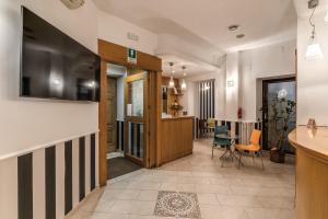 TV a/nebo společenská místnost v ubytování Roma dei Papi B&B