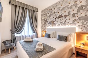 Postel nebo postele na pokoji v ubytování Roma dei Papi B&B