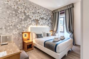 Postel nebo postele na pokoji v ubytování Roma dei Papi B&B
