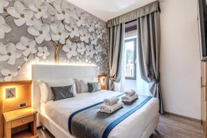 Postel nebo postele na pokoji v ubytování Roma dei Papi B&B