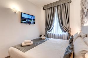Postel nebo postele na pokoji v ubytování Roma dei Papi B&B